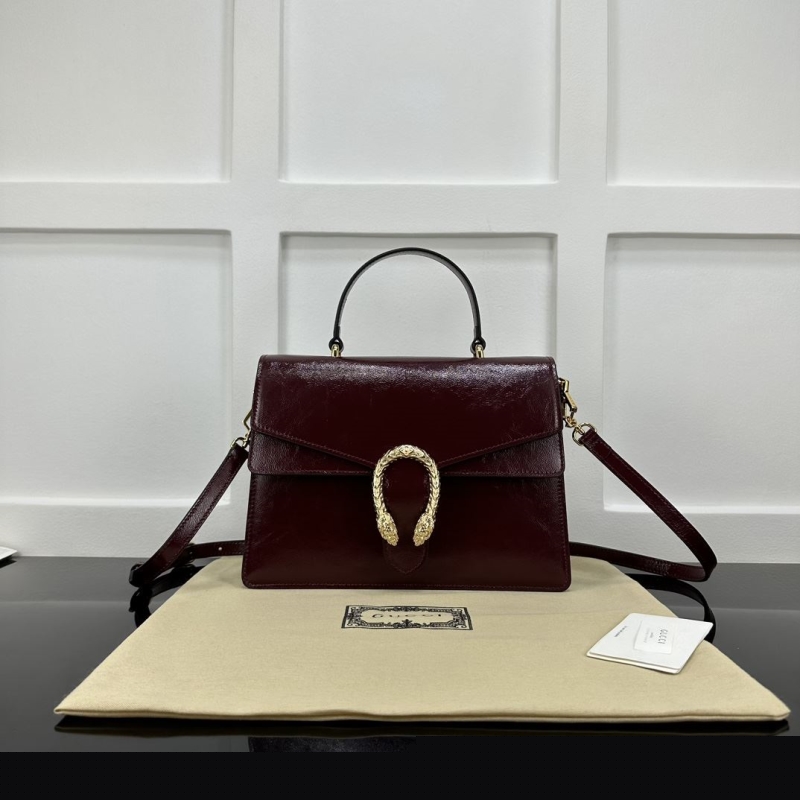 G*u*i top handle bags